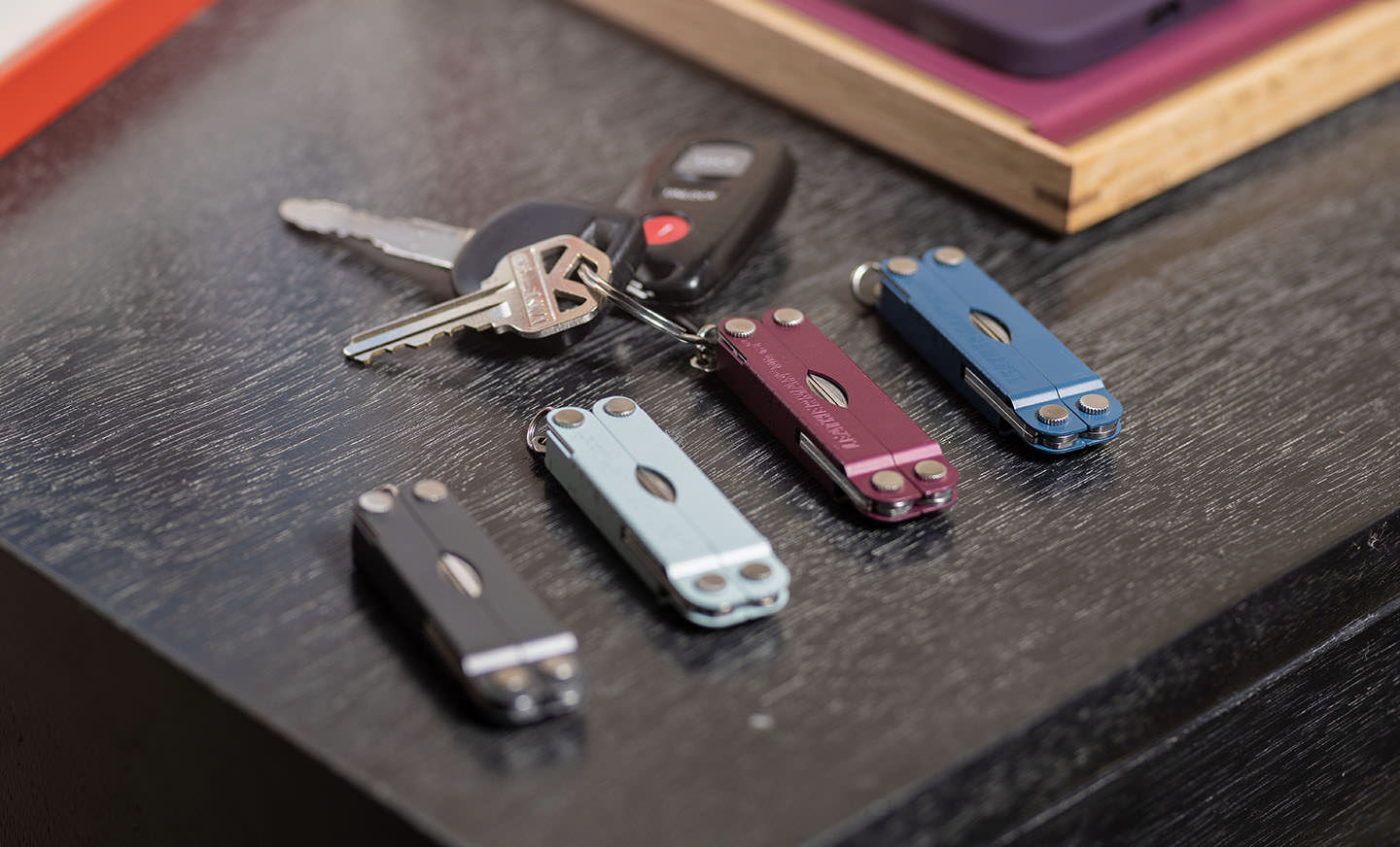 Various colored Micra on a table with keys