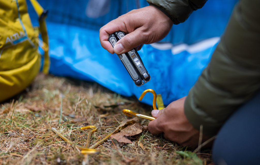 Hand using ARC to set up the tent