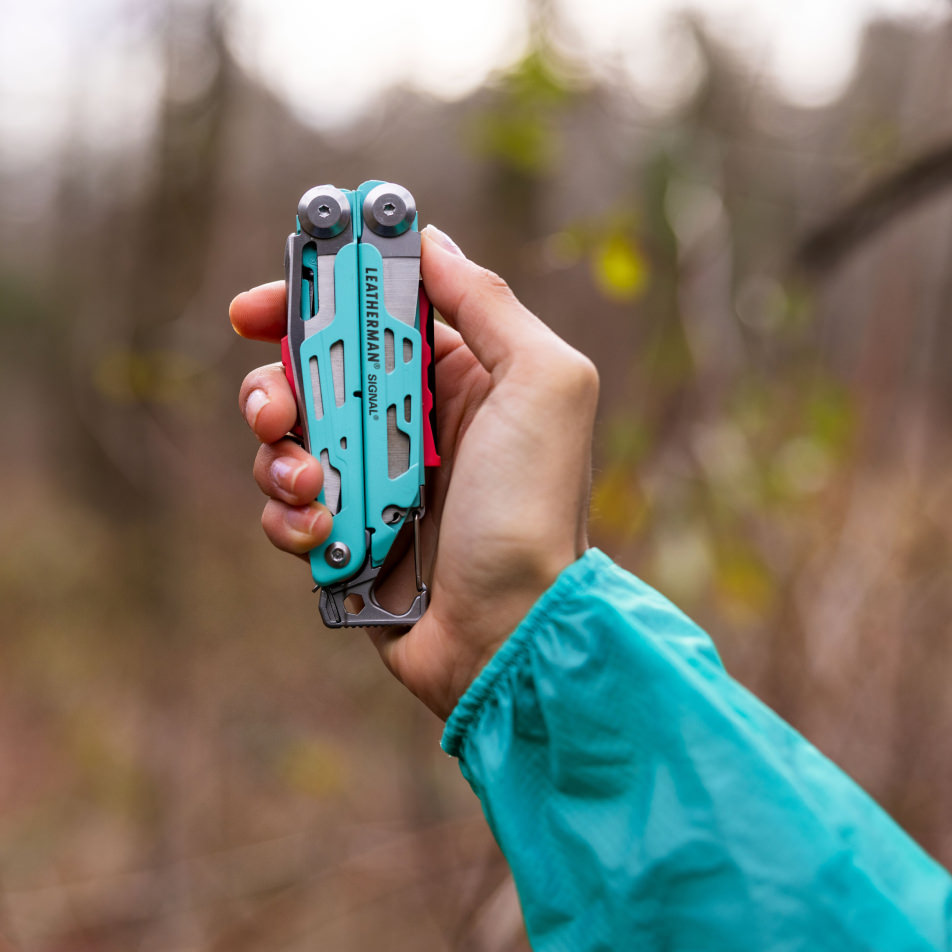 Hand holding Leatherman Aqua Signal 