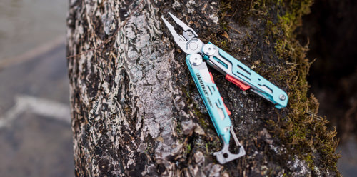 Leatherman Signal on a log