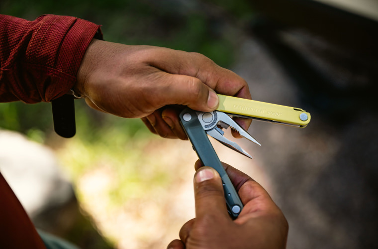 Colorful Leatherman Bond being opened in one hand.