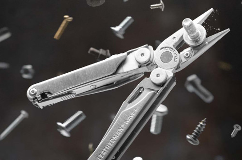 Leatherman Wave+ surrounded by scattered screws and nuts, showcasing its versatility and functionality in various tasks.