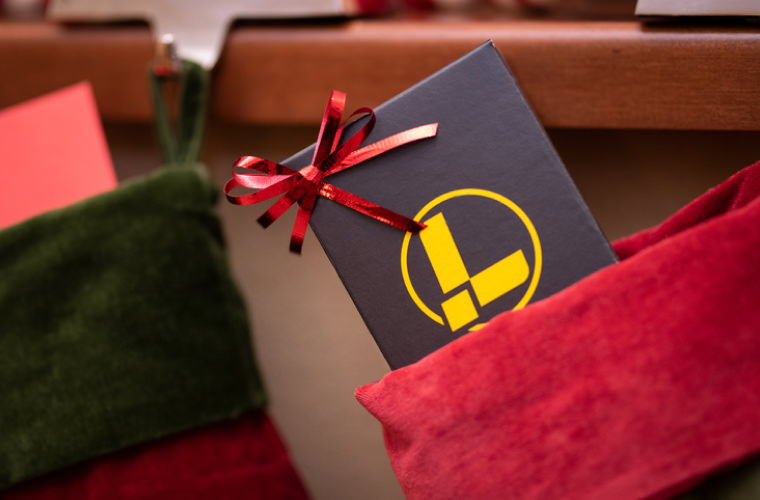 A cheerful Christmas stocking displaying Leatherman tool box, symbolizing the joy of the holiday season.