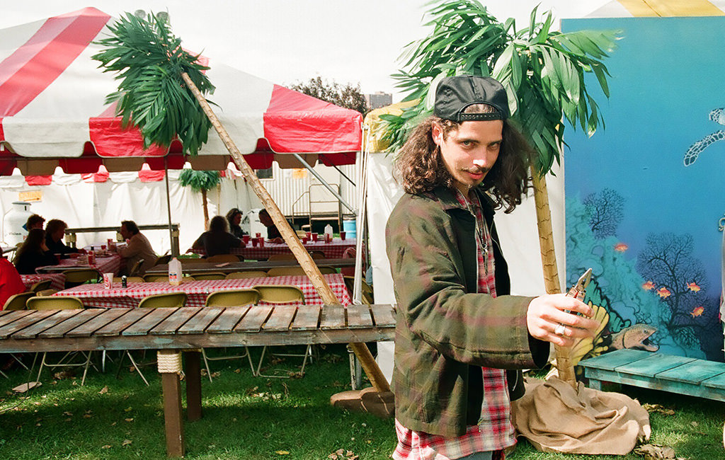 A circus sideshow performer showing his Leatherman tool.