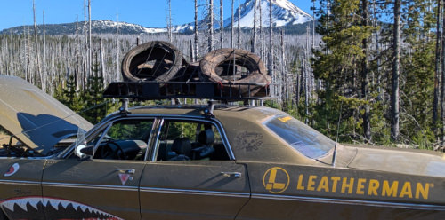 Leatherman customized car on the side of the road with hood up