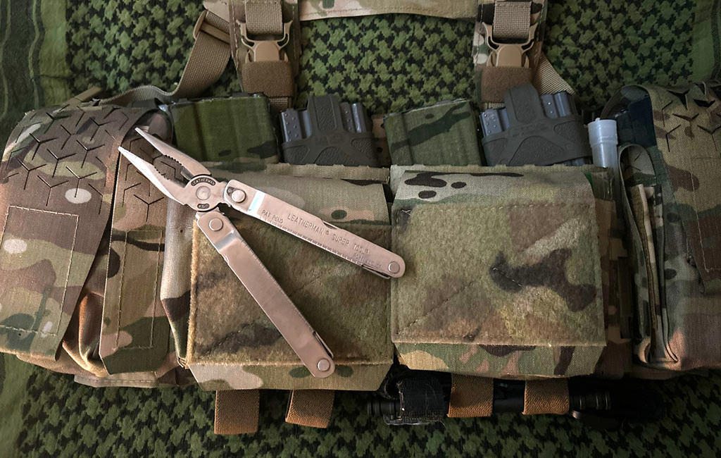 An old Leatherman Supertool on top of an Army bag.